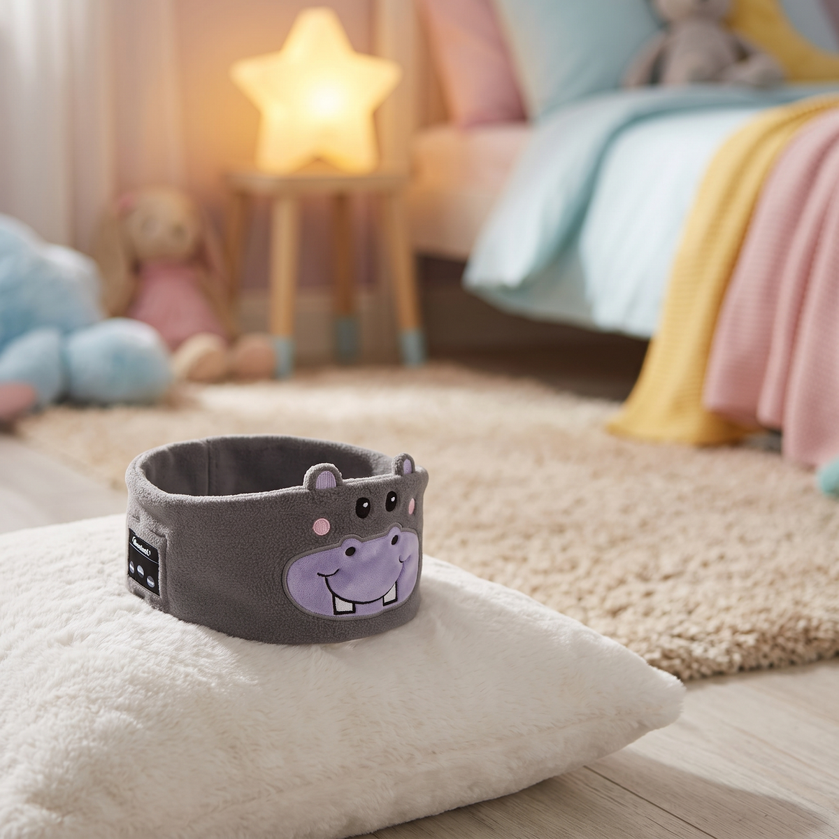 Hippo sleep mask headphones on a pillow